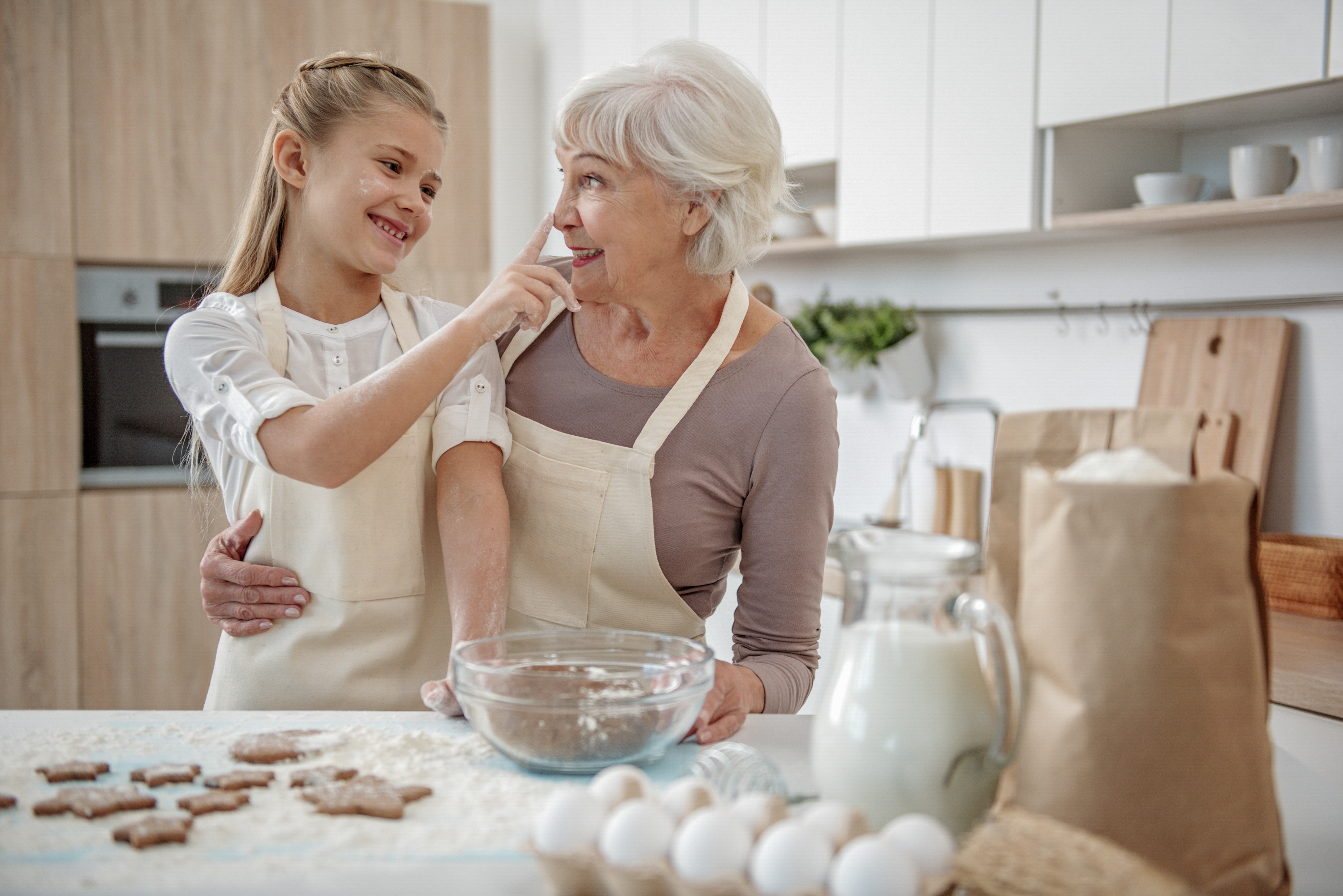 Grandma and Granddaughter baking cookies