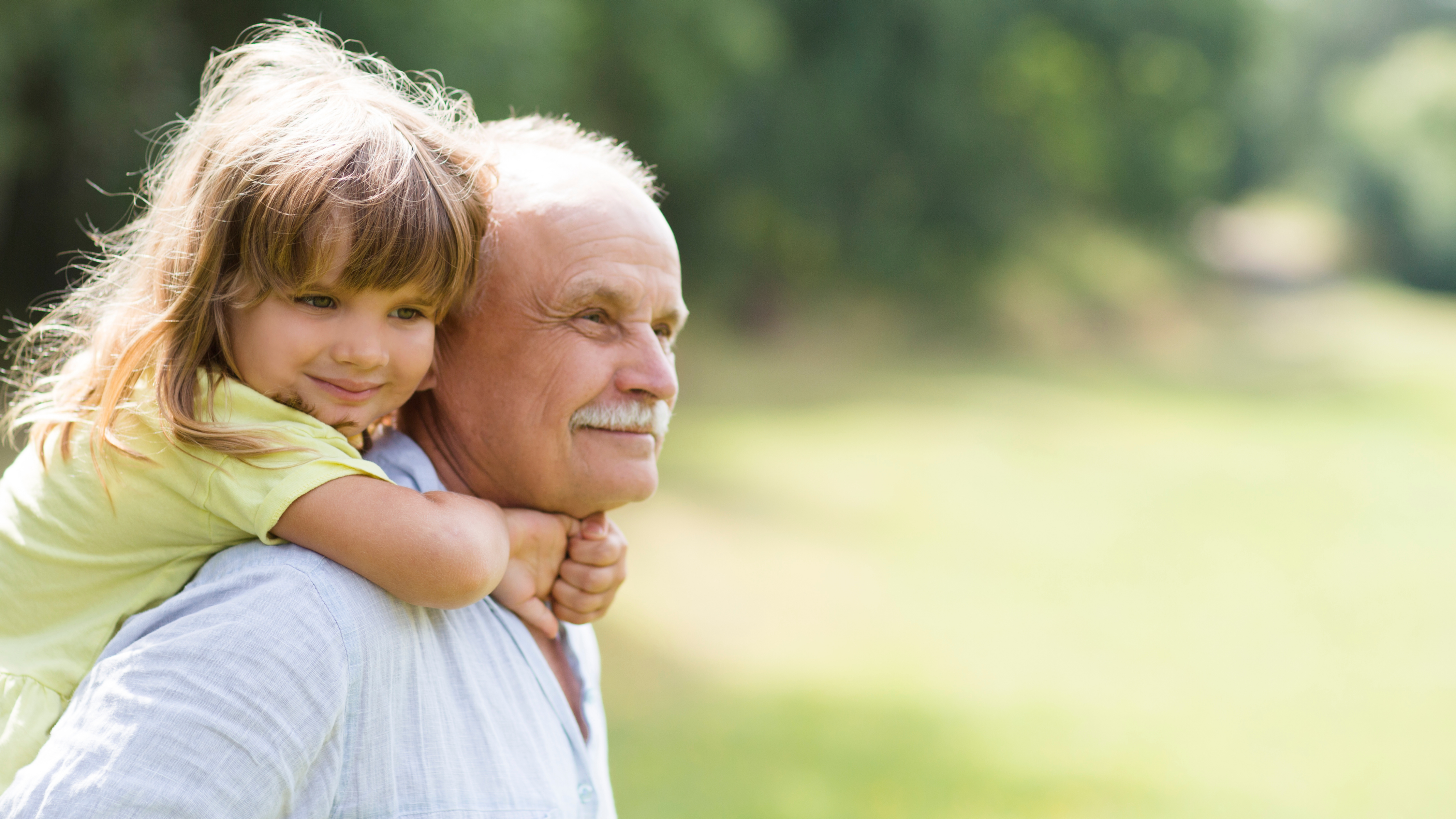 Grandpa Giving Granddaughter a Piggy Back Ride